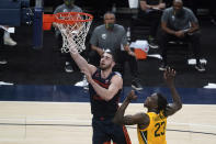 Illinois' Giorgi Bezhanishvili (15) shoots next to Baylor's Jonathan Tchamwa Tchatchoua (23) during the first half of an NCAA college basketball game Wednesday, Dec. 2, 2020, in Indianapolis. (AP Photo/Darron Cummings)