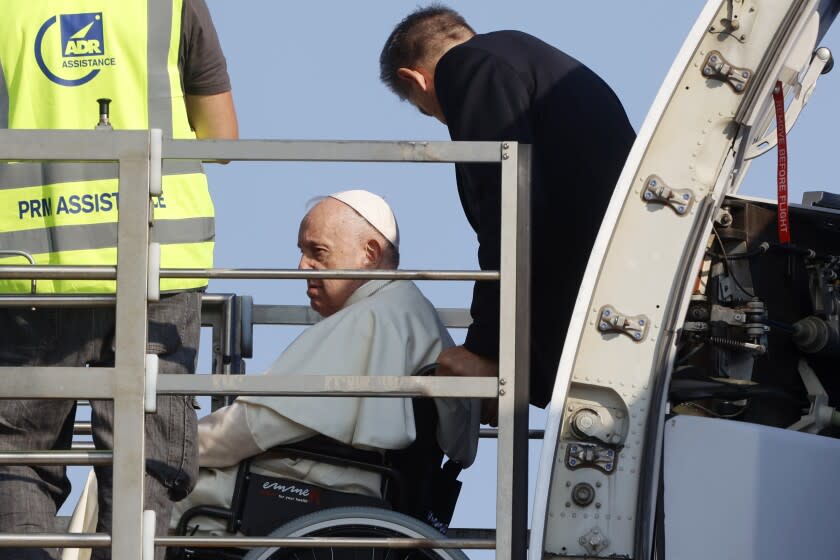 Pope Francis arrives at Rome's Leonardo da Vinci International airport Sunday, July 24, 2022, to board his flight to Edmonton, Canada, where he will start a six-day pastoral visit to the country. Pope Francis begins a weeklong trip to Canada on Sunday to apologize to Indigenous peoples for the abuses committed by Catholic missionaries in the country's notorious residential schools. (AP Photo/Riccardo de Luca)