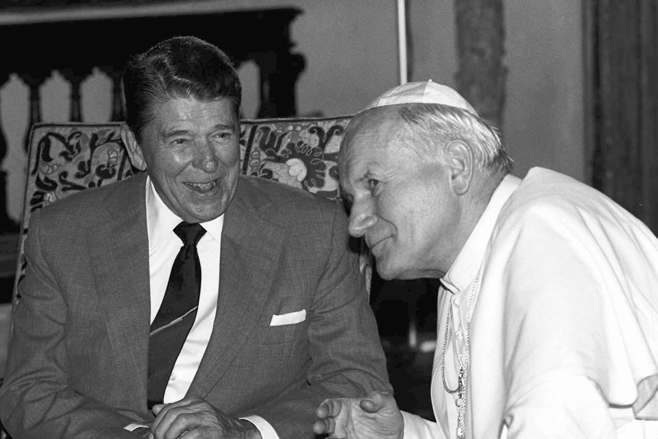 FILE - In this Sept. 10, 1987 file photo, Pope John Paul II, right, meets with President Ronald Reagan in the Vizcaya, a lavish mansion on Biscayne Bay, in Miami. President Obama met Pope Francis for the first time on Thursday, March 27, 2014, at the Vatican. (AP Photo/Arturo Mari, File)