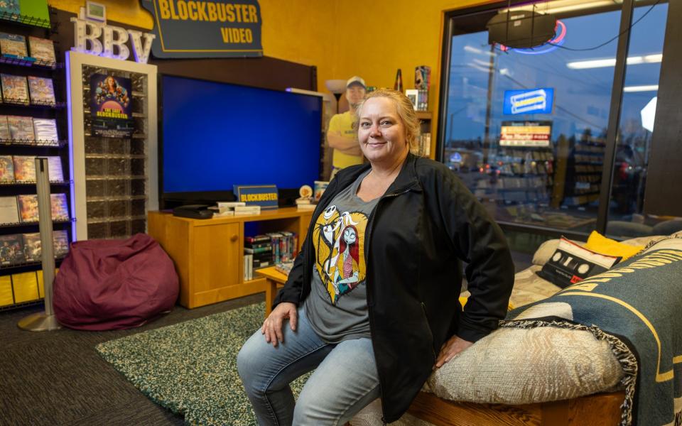 Manager Sandi Harding in the recreated 90s living room in one corner of the store