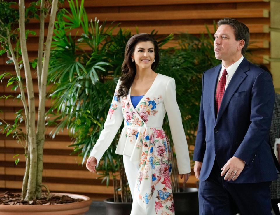 Ron and Casey hold hands as they leave Japan's premier's official residence on a trip to Tokyo (POOL/AFP via Getty Images)