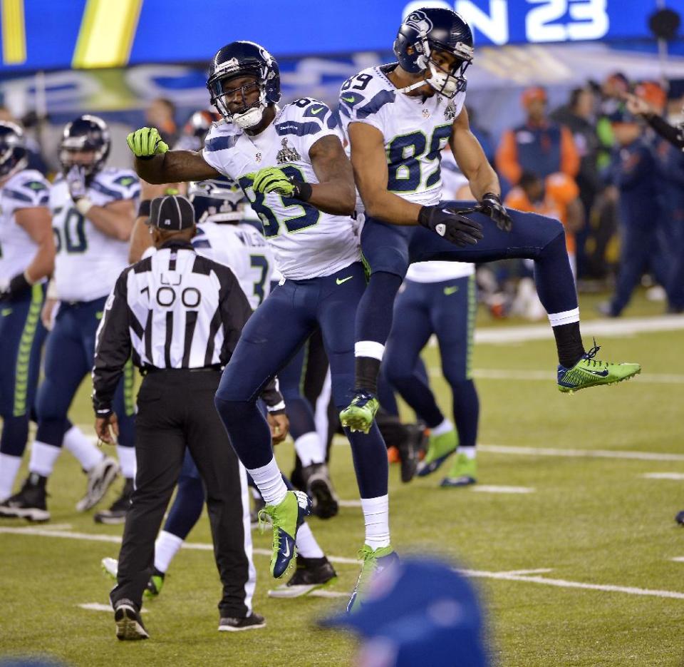 Seattle Seahawks' Ricardo Lockette (83) and Doug Baldwin celebrate during the second half of the NFL Super Bowl XLVIII football game against the Denver Broncos Sunday, Feb. 2, 2014, in East Rutherford, N.J. (AP Photo/Bill Kostroun)