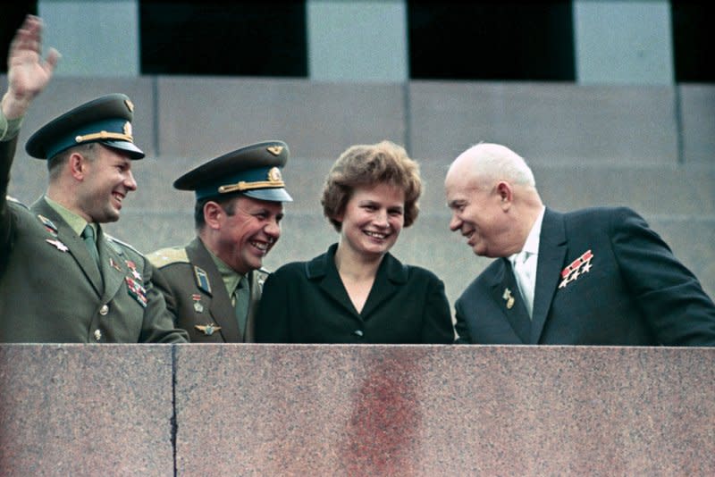 Nikita Khrushchev (R), and cosmonauts Valentina Tereshkova (2nd-R), Pavel Popovich (C) and Yuri Gagarin gather at the Lenin Mausoleum on June 22, 1963, during a demonstration dedicated to the successful space flights of the Vostok-5 and Vostok-6 spacecraft. On June 16, 1963, the Soviet Union put the first woman into space, cosmonaut Tereshkova. File Photo courtesy of RIA Novosti/Wikimedia
