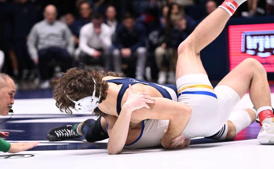 Penn State’s Levi Haines, right, pins Hofstra’s Dylan Zenion (157 lbs) during Sunday’s match at Rec Hall at University Park. Penn State defeated Hofstra, 43-10.