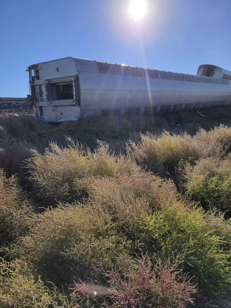 This photo provided by Kimberly Fossen shows an Amtrak train that derailed on Saturday, Sept. 25, 2021, in north-central Montana. Multiple people were injured when the train that runs between Seattle and Chicago derailed Saturday, the train agency said. (Kimberly Fossen via AP)