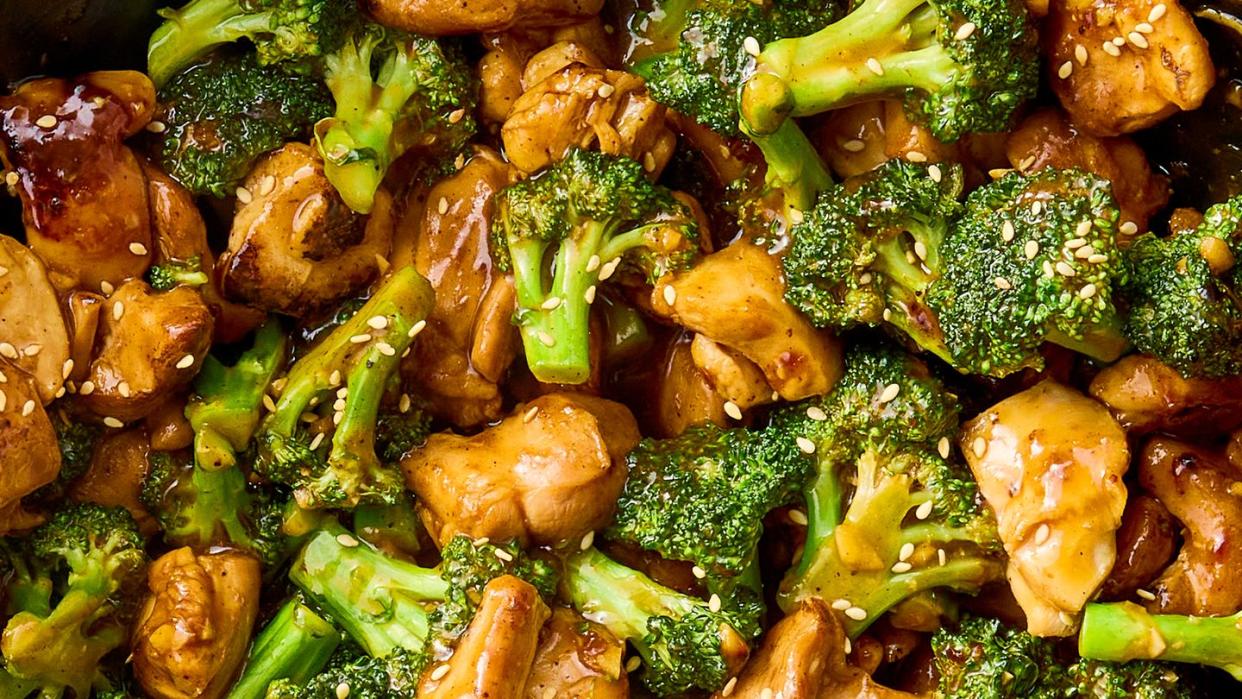 stir fried pieces of chicken and broccoli