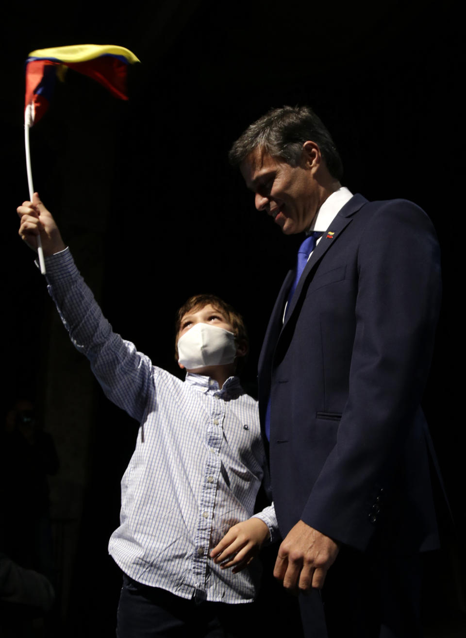 Venezuelan opposition leader Leopoldo Lopez arrives with his soon Leopoldo for a news conference in Madrid on Tuesday, Oct. 27, 2020. Prominent opposition activist Leopoldo López who has abandoned the Spanish ambassador's residence in Caracas and left Venezuela after years of frustrated efforts to oust the nation's socialist president is holding a news conference in Madrid. (AP Photo/Andrea Comas)