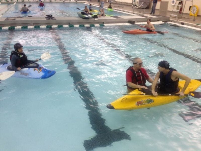 Kayakers practice their rolls and other moves in the Concord High School pool in Elkhart several years ago.