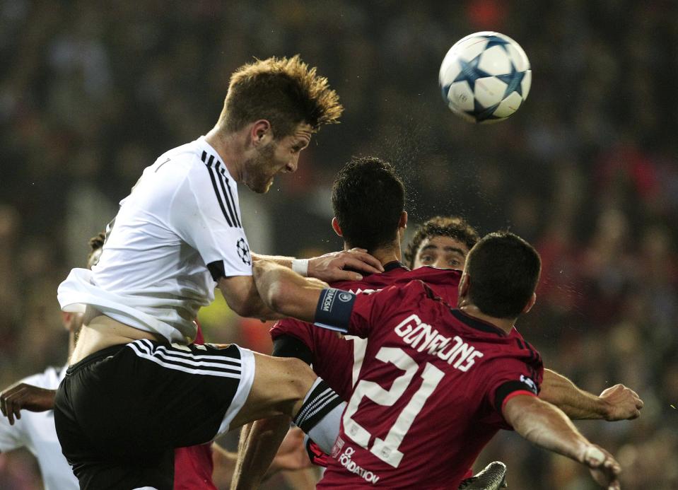 Football Soccer - Valencia v Olympique Lyon - Champions League Group stage - Group H - Mestalla Stadium, Valencia, Spain, 9/12/15.Valencia's Shkodran Mustafi (top) heads the ball. REUTERS/Heino Kalis