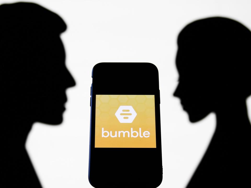 Bumble logo behind silhouettes of a man and a woman