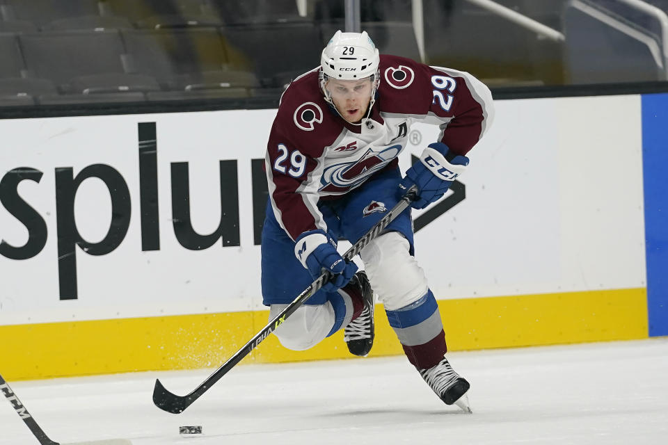 Colorado Avalanche center Nathan MacKinnon (29) skates against the San Jose Sharks during the second period of an NHL hockey game in San Jose, Calif., Wednesday, March 3, 2021. (AP Photo/Jeff Chiu)