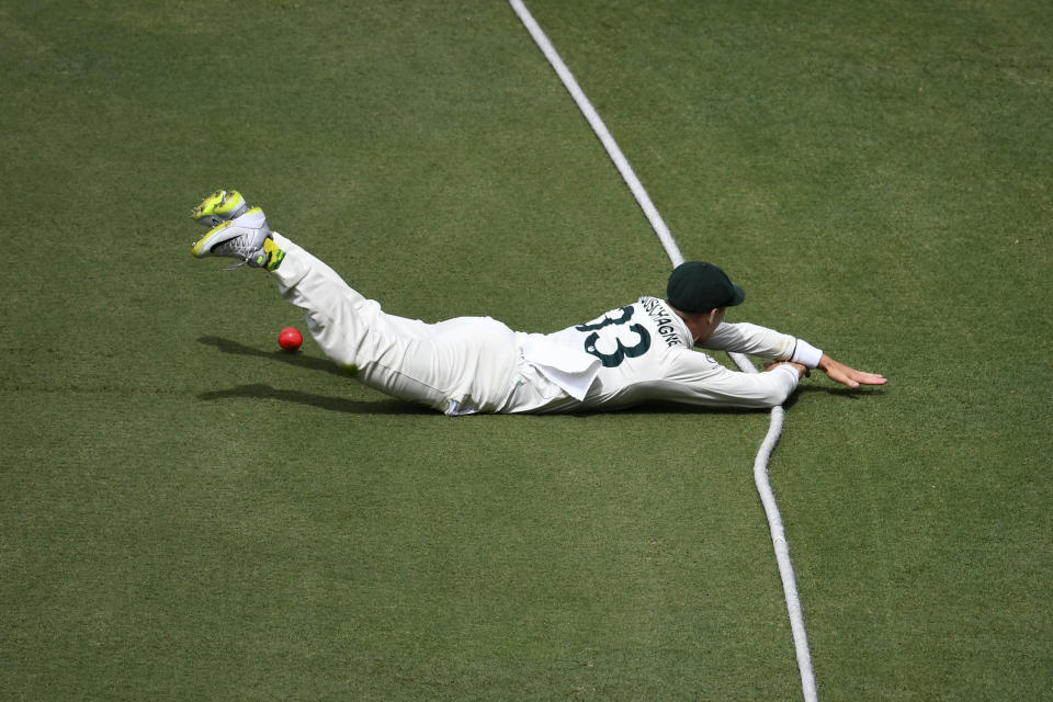 Australia's Marnus Labuschagne slides into the boundary rope while fielding against the West Indies on the third day of their cricket test match in Brisbane, Saturday, Jan. 27, 2024. (Darren England/AAP Image via AP)