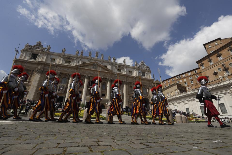 Swiss guards march in St. Peter's Square at the Vatican, Sunday, April 16, 2017. Pope Francis celebrated Easter Sunday Mass in St. Peter's Square, decorated with colorful spring flowers. (AP Photo/Gregorio Borgia)