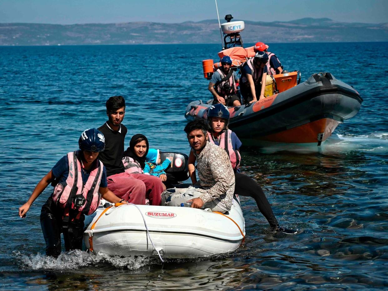 Migrants helped by rescuers arrive on the Greek island of Lesbos after crossing the Aegean Sea from Turkey: AFP/Getty