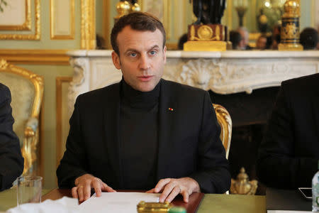 French President Emmanuel Macron speaks during a Trianon Council meeting (Conseil de coordination du dialogue de Trianon) aiming to strenghten the links between France and Russia at the Elysee Palace in Paris, France, Febuary 9, 2018. REUTERS/Ludovic Marin/Pool