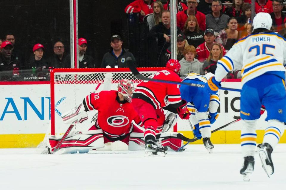 Carolina Hurricanes goaltender Antti Raanta (32) stops the scoring attempt by Buffalo Sabres center Peyton Krebs (19) during the first period at PNC Arena.