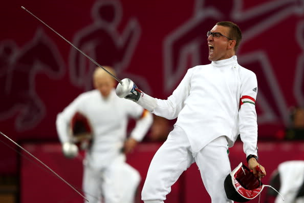 Adam Marosi of Hungary celebrates winning a bout in the fencing during the Men's Modern Pentathlon on Day 15 of the London 2012 Olympic Games on August 11, 2012 in London, England. (Photo by Quinn Rooney/Getty Images)