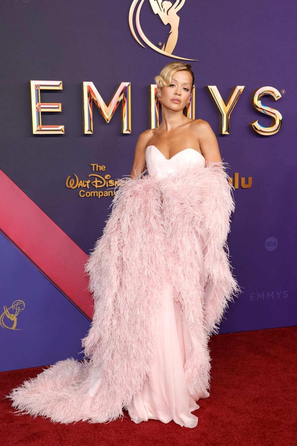 Rita Ora plucked the satin pink ensemble from Tamara Ralph’s fall/winter2024 collection (Getty Images)