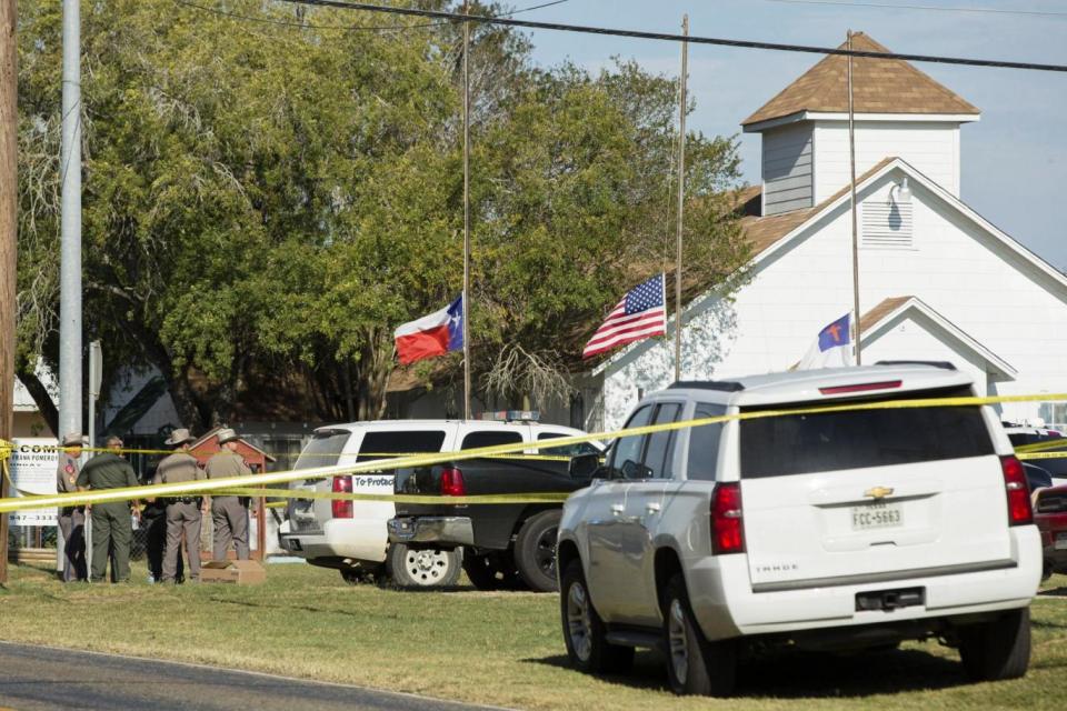 Law enforcement officials gather near the First Baptist Church in Sutherland Springs (Getty Images)