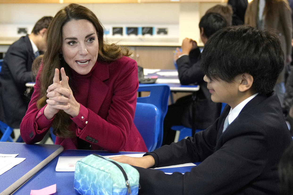 The Duchess of Cambridge speaks to students during a visit to Nower Hill High School in Harrow, north London, to join a science lesson studying neuroscience and the importance of early childhood development. Picture date: Wednesday November 24, 2021.