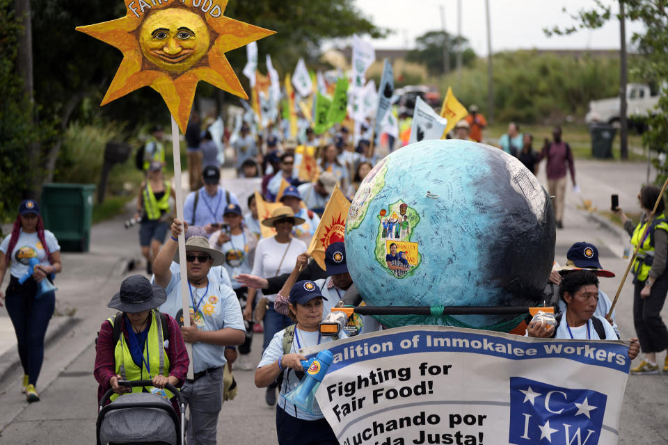 Farmworkers and allies set off on a five-day trek aimed at highlighting the Fair Food Program, which has enlisted food retailers to use their clout with growers to ensure better working conditions and wages for farmworkers, Tuesday, March 14, 2023, in Pahokee, Fla. (AP Photo/Rebecca Blackwell)