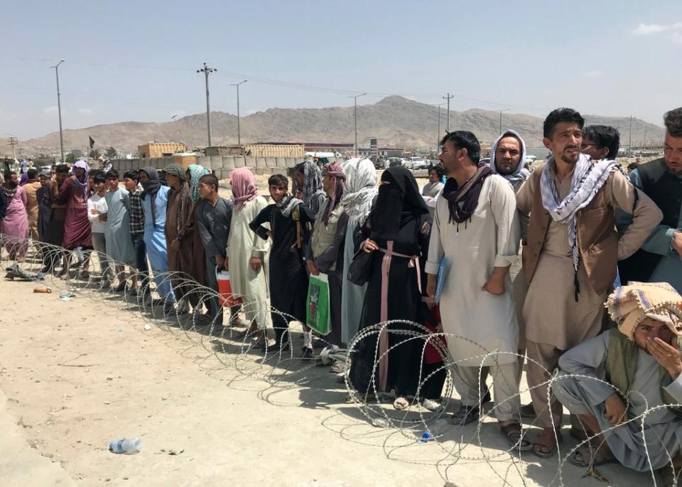 Hundreds of people gather outside the international airport in Kabul, Afghanistan (AP) (AP)