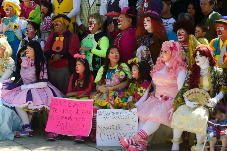 Clowns pose at the 21st International Clown Convention in Mexico City to counter the "creepy clown" craze that has swept across the US, Europe and now Mexico