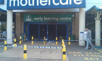 Police cordon off a Mothercare in Colliers Wood after rioters attacked the South London store. Image- Nick Wales