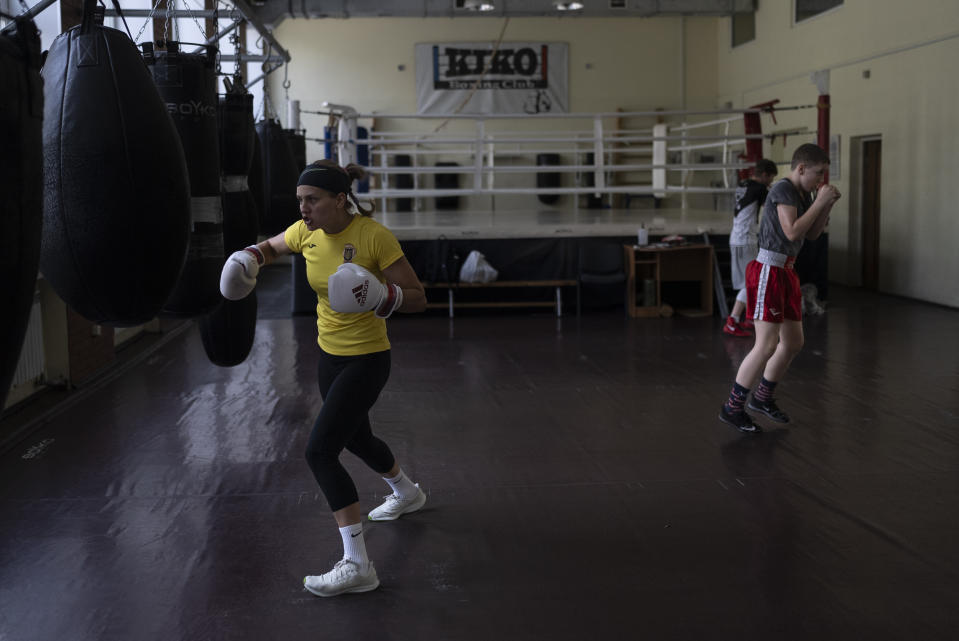 Ukrainian boxer Anna Lysenko, left, trains at Kiko Boxing Club in Kyiv, Ukraine, Thursday, July 6, 2023. Lysenko dedicates long hours preparing for next year's Paris Olympics despite the unsettling sounds of explosions booming outside. (AP Photo/Jae C. Hong)