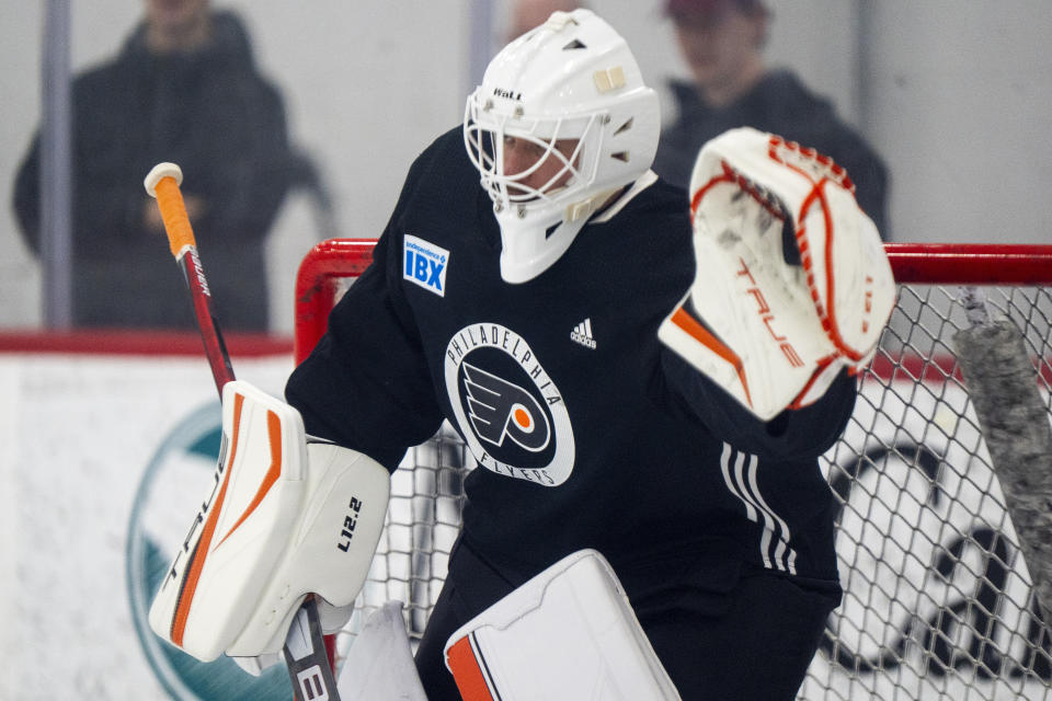 Philadelphia Flyers' Ivan Fedotov takes to the ice for some NHL hockey practice following his introductory press conference, Friday, March 29, 2024, in Voorhees, N.J. (AP Photo/Chris Szagola)