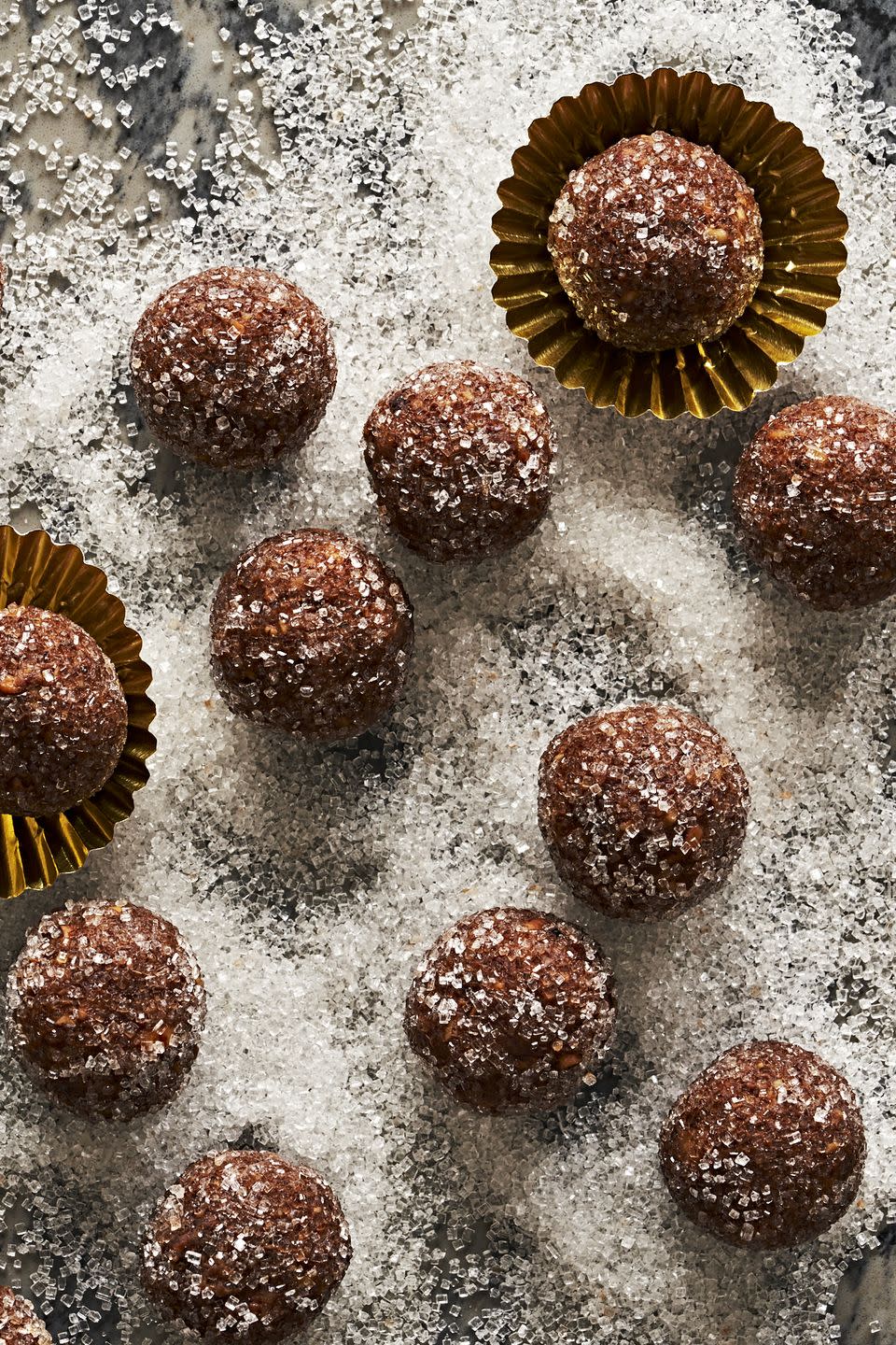 <p>If you’re looking for a boozy treat to get the party started, these bourbon balls are calling your name. Made with finely chopped pecans, crushed vanilla wafer cookies, and of course, bourbon, these no-bake cookie <a href="https://www.delish.com/cooking/recipe-ideas/g40691868/truffle-recipes/" rel="nofollow noopener" target="_blank" data-ylk="slk:truffles;elm:context_link;itc:0;sec:content-canvas" class="link ">truffles</a> highlight the flavor of the bourbon while taming its typical burn. Warning: You won’t be able to stop at one!</p><p>Get the <strong><a href="https://www.delish.com/cooking/recipe-ideas/a40930591/bourbon-balls-recipe/" rel="nofollow noopener" target="_blank" data-ylk="slk:Bourbon Balls recipe;elm:context_link;itc:0;sec:content-canvas" class="link ">Bourbon Balls recipe</a></strong>.</p>