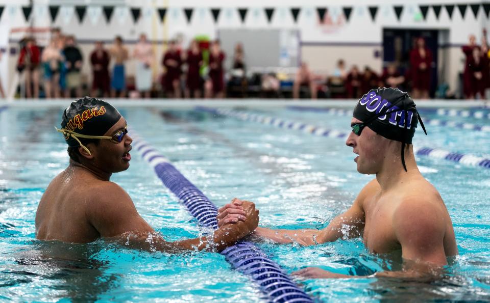 South's Lukas Paegle & North's Jay Stewart congratulate each other following the Boy's 100 Yard Butterfly race during the 2024 Counsilman Classic Swimming & Diving Meet between the Bloomington North Cougars and Bloomington South Panthers at Bloomington High School South Natatorium on January 13, 2024