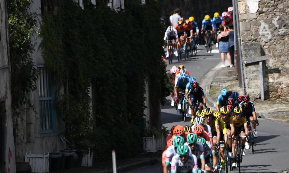 The pack rides in late French cyclist Raymond Poulidor’s hometown Saint-Leonard-de-Noblat during the 12th stage between Chauvigny and Sarran.