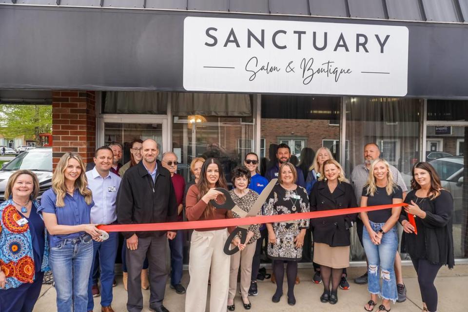 Sanctuary Salon, located at 119 W. State St. in O’Fallon, rebranded with a new logo and signage under the name Sanctuary Salon and Boutique and has been making great strides. Pictured cutting the ribbon is owner Andrea Donze.