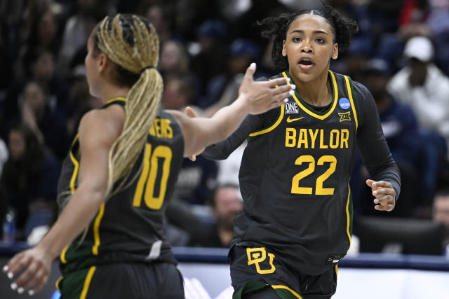 Baylor's Bella Fontleroy (22) slaps hands with Baylor's Jaden Owens (10) in the first half of a second-round college basketball game against UConn in the NCAA Tournament, Monday, March 20, 2023, in Storrs, Conn. (AP Photo/Jessica Hill)