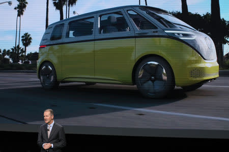 Dr. Herbert Diess, CEO, Volkswagen AG, speaks in front of an image of a van concept vehicle during the company's presentation at the North American International Auto Show in Detroit, Michigan, U.S., January 14, 2019. REUTERS/Jonathan Ernst