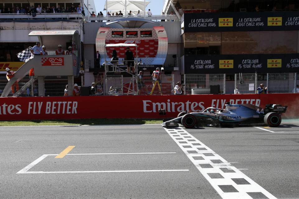 Mercedes driver Lewis Hamilton of Britain crosses the finish line during the Spanish Formula One race at the Barcelona Catalunya racetrack in Montmelo, just outside Barcelona, Spain, Sunday, May 12, 2019. (AP Photo/Joan Monfort)