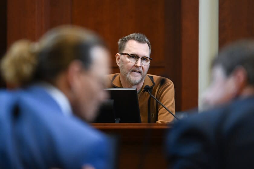 Morgan Higby Night, a writer, director and producer, testifies in the courtroom at the Fairfax County Circuit Courthouse in Fairfax, Va., Tuesday, May 24, 2022. Depp sued his ex-wife Amber Heard for libel in Fairfax County Circuit Court after she wrote an op-ed piece in The Washington Post in 2018 referring to herself as a "public figure representing domestic abuse." (Jim Watson/Pool photo via AP)