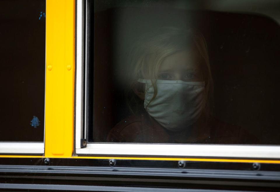 Sept. 8: A young girl looks out the school bus window after the first day of school at South Terrace Elementary School in Carlton, Minnesota. (Getty Images)