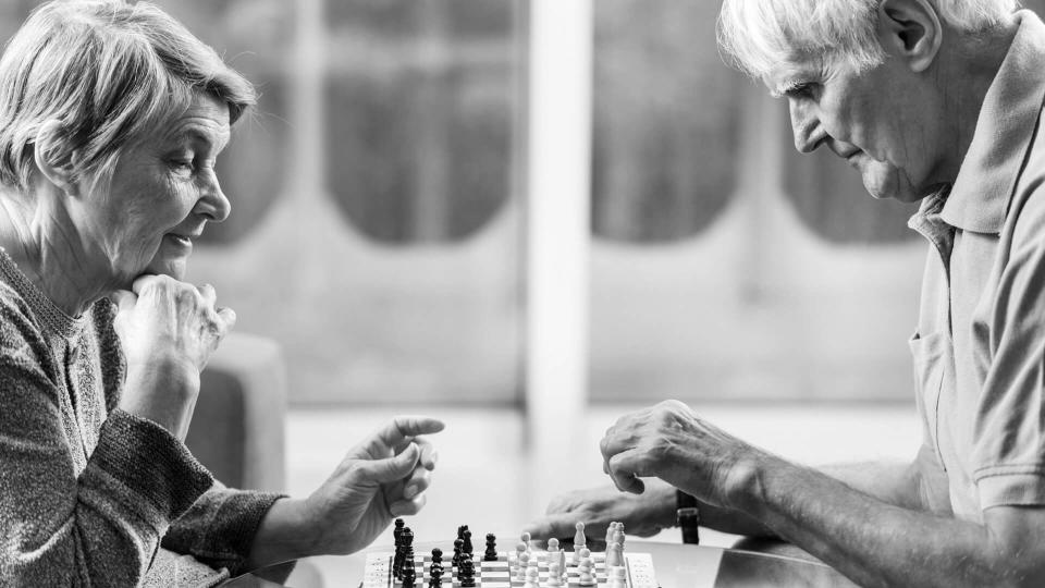 couple playing chess together