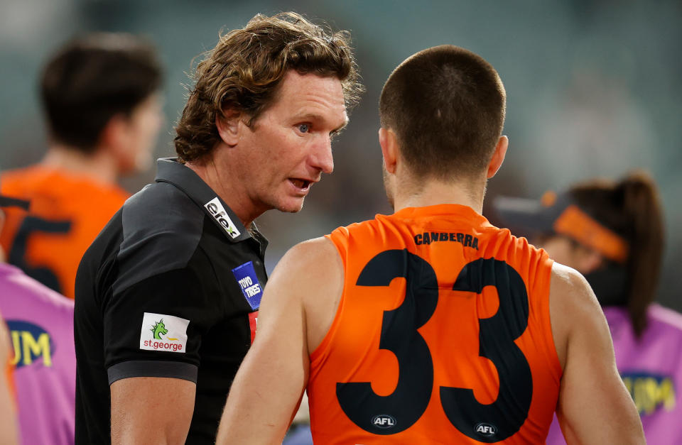 James Hird, pictured here speaking to Xavier O'Halloran during a GWS game in 2022.