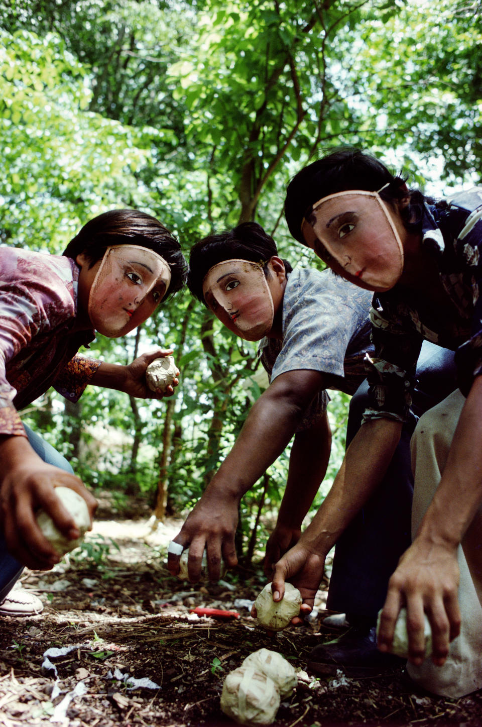 “This image has always sparked a memory of reflection for me. It was the first time I felt a subject was using me to make the photograph they wanted so that their message could get out. It was taken in Masaya, Nicaragua just before the popular insurrection against the Somoza dictatorship took hold. The Indigenous community used these traditional dance masks to protect their identity. They were practicing future attacks with homemade contact bombs. They simply wanted the world to know. The surprise for me was that it was used on the cover of The New York Times Magazine, my first ever in the media. I remain ambivalent about the performative in photography. I have never thought of myself as a portraitist, and still prefer to make connections through a process of immersion.” -- Susan Meiselas (Nicaragua, 1981) 