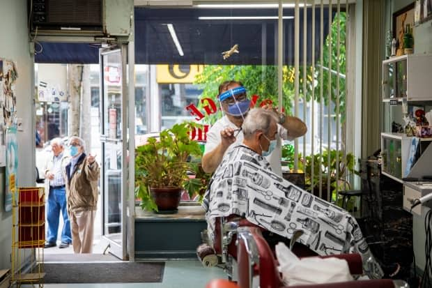 Ontario will enter Step 2 of reopening June 30, 2020, including hair salons and barber shops.  (Carlos Osorio/Reuters - image credit)