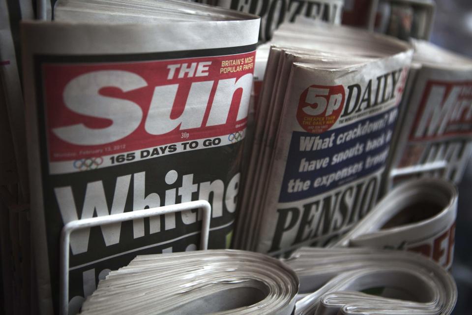 Copies of The Sun newspaper are displayed at a kiosk in London February 13, 2012.  Rupert Murdoch is under pressure over his Sun tabloid after the arrests of several senior staff in a corruption probe, but whistleblowers inside his media empire may pose more of a threat than the public outrage that forced the closure of its sister paper, News of the World weekly, after allegations of phone hacking.  REUTERS/Finbarr O'Reilly (BRITAIN - Tags: MEDIA CRIME LAW SOCIETY)