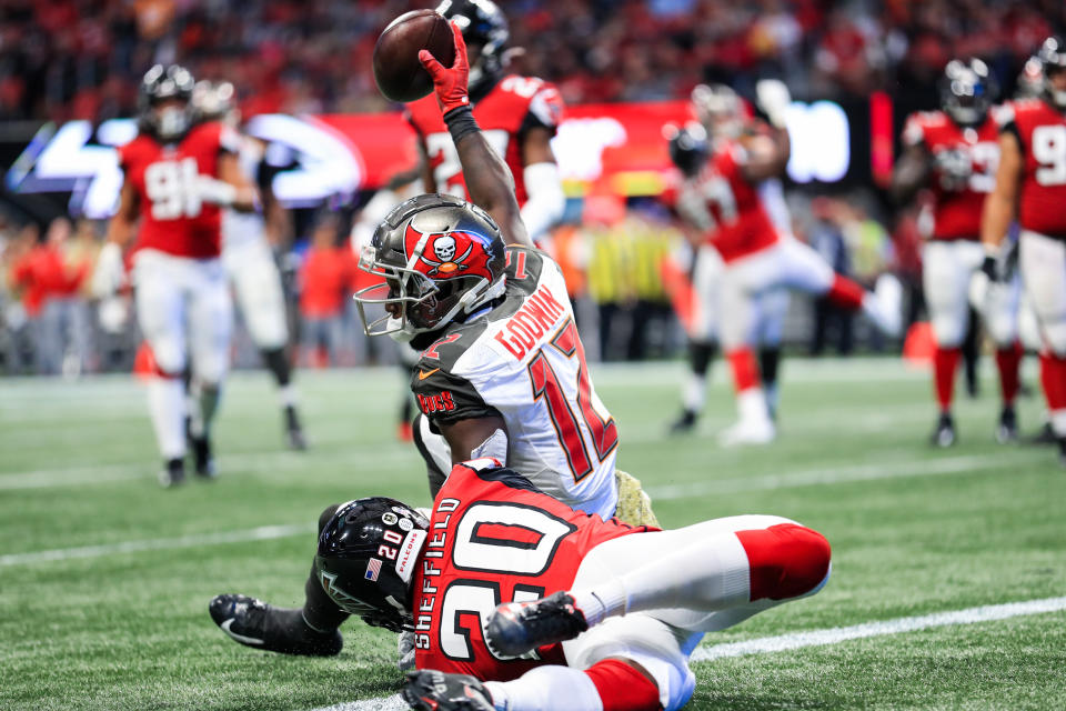 ATLANTA, GA - NOVEMBER 24: Chris Godwin #12 of the Tampa Bay Buccaneers catches a pass for a touchdown in front of Kendall Sheffield #20 of the Atlanta Falcons during the first half at Mercedes-Benz Stadium on November 24, 2019 in Atlanta, Georgia. (Photo by Carmen Mandato/Getty Images)