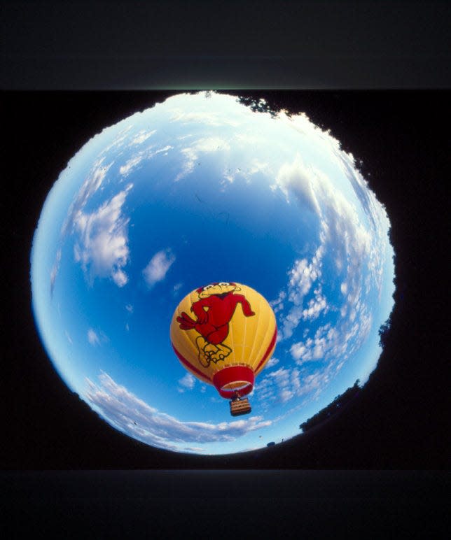 "Cy in the air" is a 70-foot hot air balloon with Cy on one side and the words Iowa State and logo on the other.