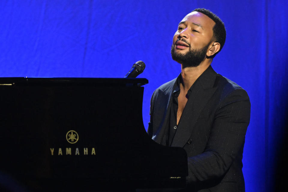 John Legend playing piano