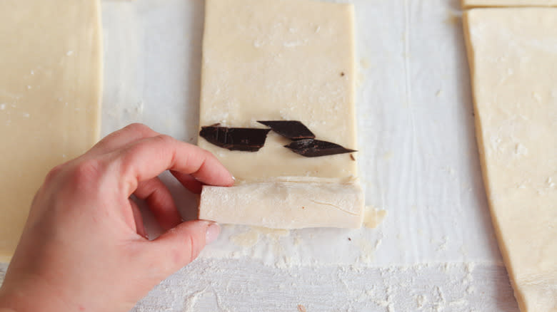 dough rolled over chocolate