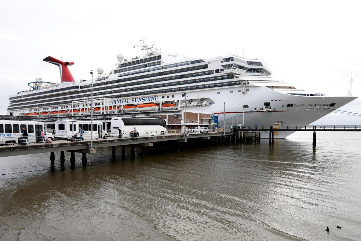 Mandatory Credit: Photo by Mic Smith/AP/Shutterstock (10584695g) Passengers disembark from the Carnival Sunshine cruise ship, in Charleston, S.C. Passengers said they had their temperature taken before getting on the cruise ship for the four-day cruise to the Bahamas but did not have their temperature taken getting off. According to passengers, cruise officials did ask them if they felt okay when leaving Virus Outbreak South Carolina, Charleston, United States - 16 Mar 2020
