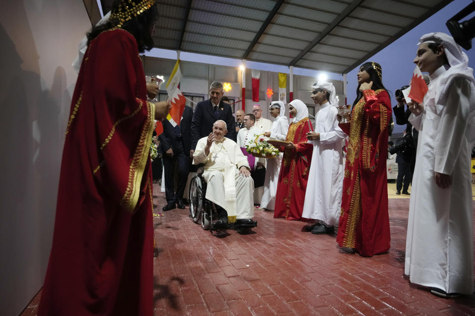 Pope Francis arrives for a meeting with the youth at the Sacred Heart School in Manama, Bahrain, Saturday, Nov. 5, 2022. Pope Francis is making the November 3-6 visit to participate in a government-sponsored conference on East-West dialogue and to minister to Bahrain's tiny Catholic community, part of his effort to pursue dialogue with the Muslim world. (AP Photo/Alessandra Tarantino)